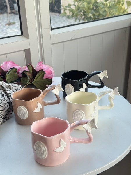 كوب الفراشة يد طويلة